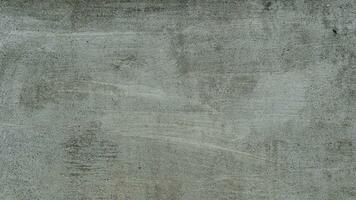 Background and textured above view of cement wall light gray color. Cement surface with old plaster floats. There are fine air bubbles floating in groups.Old floor with black mold sporadic. photo