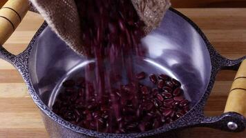 Raw red kidney bean seed grains poured into the pan video