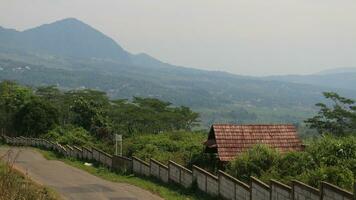 View of a mountain covered in mist and clear clouds photo