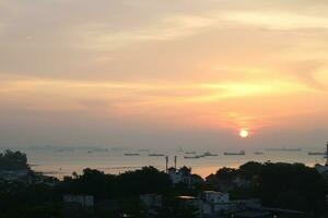 View of the sunset from the top of the building photo