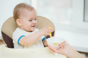 mother feeding her baby breast porridge day photo