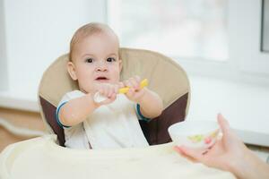 mother feeding her baby breast porridge day photo