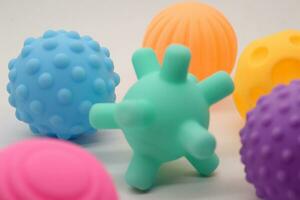 Collection of small rubber ball toys of various colors photo