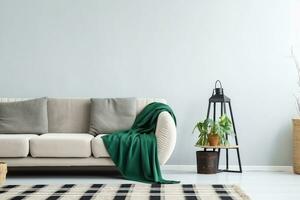 beige sofá con verde cobija y cojines en pie en contra blanco, vacío pared en minimalista vivo habitación. generativo ai. foto