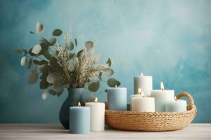 ardiente velas, cesta y florero con eucalipto en contra azul fondo, generativo ai. foto