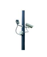 CCTV security camera on pole on white background photo