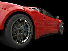 Dark red race car - rear wheel closeup photo