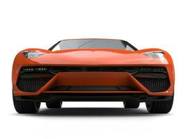 Orange modern sports car - low angle front view photo