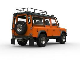 Sun orange heavy off road vehicle - tail view photo