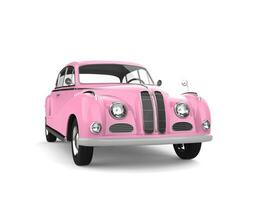 Classic vintage luxury car in candy pretty pink color - front view photo