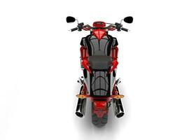 Raging red modern chopper motorcycle - top down rear shot photo