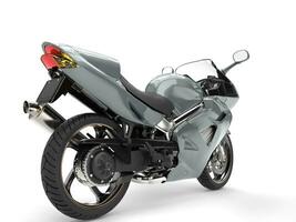 Grey metallic modern sports motorcycle - rear wheel closeup photo