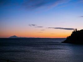 Amazing sunset with island of Thassos on the horizon photo