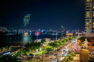 Ho Chi Minh, Viet Nam - 6 August 2023 Riverboat on the Saigon River at night, in the distance is the Landmark 81 building photo