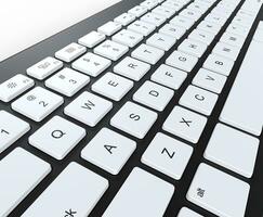 Black keyboard with white keys, angled closeup shot. photo