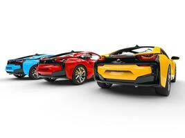 Three sports cars - primary colors - back view - isolated on white background. photo