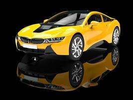 Modern yellow sports car - isolated on black reflective background. photo