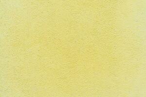 hormigón pared textura detalle - natural estuco superficie modelo antecedentes pintado en amarillo foto
