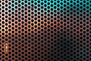 close up of a metal grate with small round holes - background for use as a texture - old textured background photo