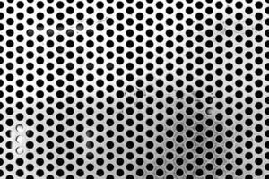 close up of a metal grate with small round holes - background for use as a texture - chrome textured background photo