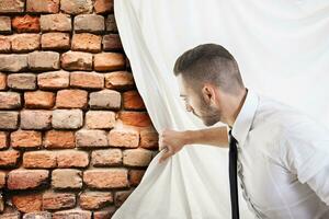 businessman pulls the curtain and discovers a brick wall photo