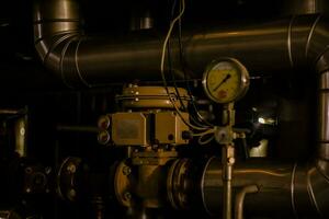 A pressure gauge inside of a beer plant brewery photo