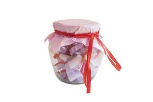 Couples date jar or glass jar filled with paper notes isolated on white photo