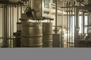 Beer kegs on the production line in the factory photo