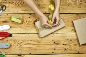 Woman Packing A Christmas Gift photo