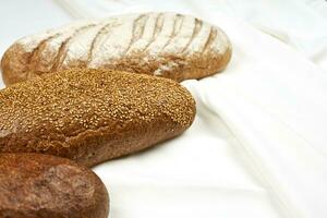 Three types of bread on white photo