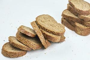 Pile of loaf bread slices photo