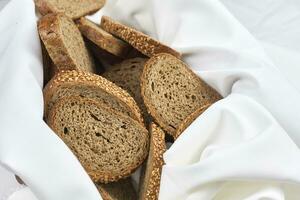 Pile of loaf bread slices photo