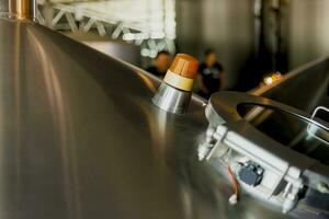 brewery stainless steel tanks. business concept brewed beer, beer production photo
