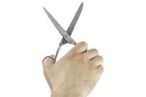 hairdresser hand cutting with scissors photo