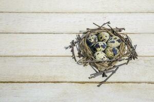 Easter eggs on bright wooden table photo