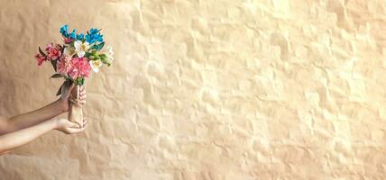 Woman holding beautiful bouquet of spring flowers photo