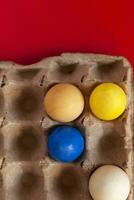 Colorful easter eggs in carton photo