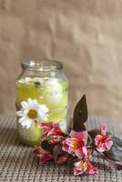 Colorful spring flower and jar full with easter eggs photo