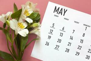 May monthly calendar and spring flower photo