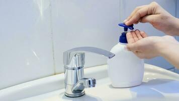 Woman washing hands photo