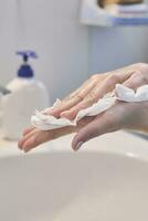 Woman washing hands photo