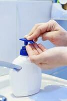 Woman washing hands photo