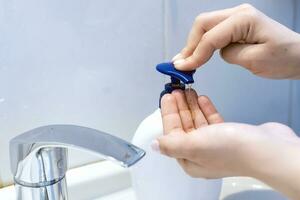 Woman washing hands photo