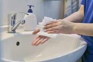 Woman washing hands photo