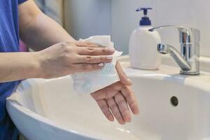 Woman washing hands photo