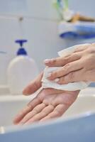 Woman washing hands photo