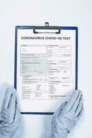 Doctor filling medical form for coronavirus test photo