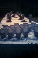 Snacks for drinking beer. Table served with plastic cups and bowls of appetizing croutons. photo