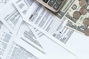 US Tax Forms.Tax forms background. The concept of tax settlement. photo