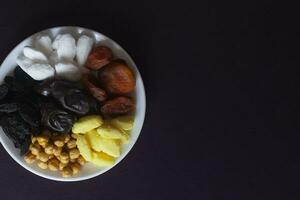 Eid Mubarak. Different iftar sweets. Celebrating Eid Al Adha. Islamic traditional holiday. Eid al-Fitr. Holly month Ramadan. Middle Eastern religious holiday. Dried date fruit. Flat lay, top view. photo